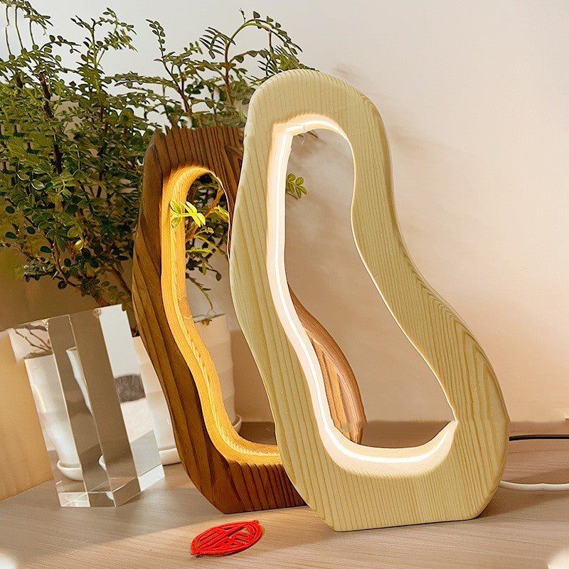 Hollow design, LED glow, wooden charm, simple style desktop lamp.